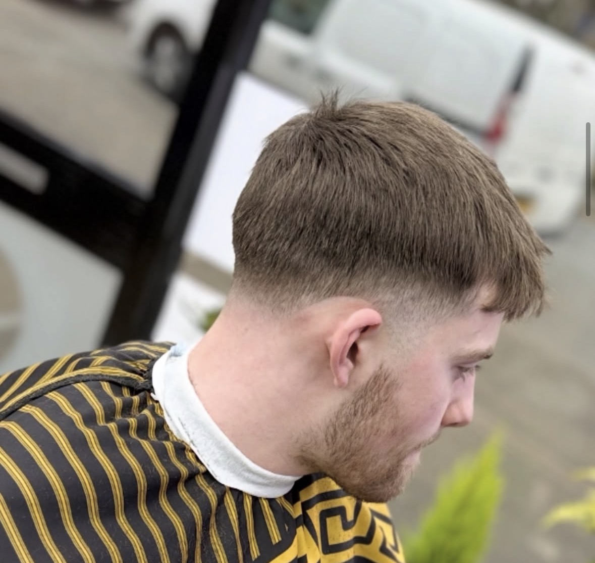 Short textured cut with a subtle skin fade