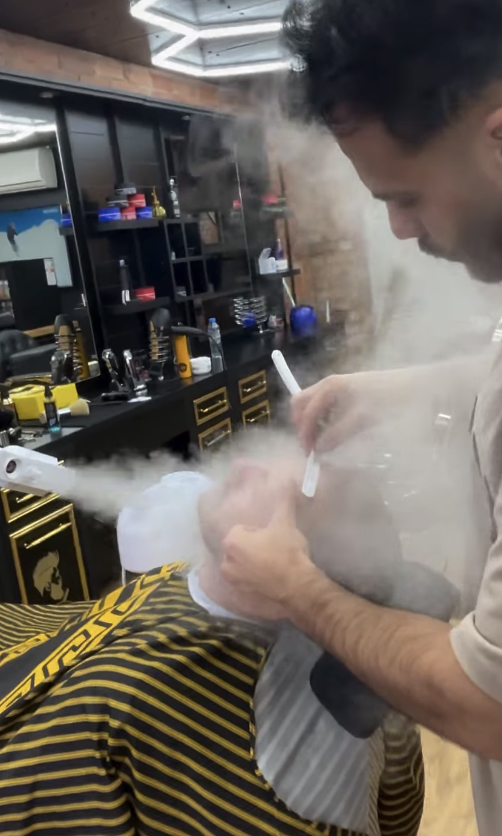 Traditional hot towel shave with a straight razor at M&A Barber Studio